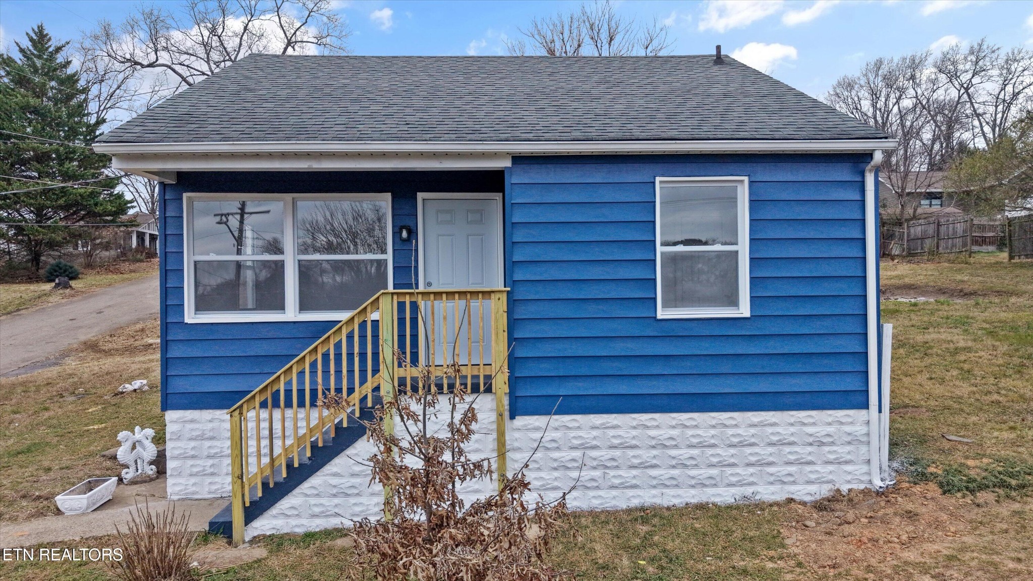 a view of wooden house with large windows