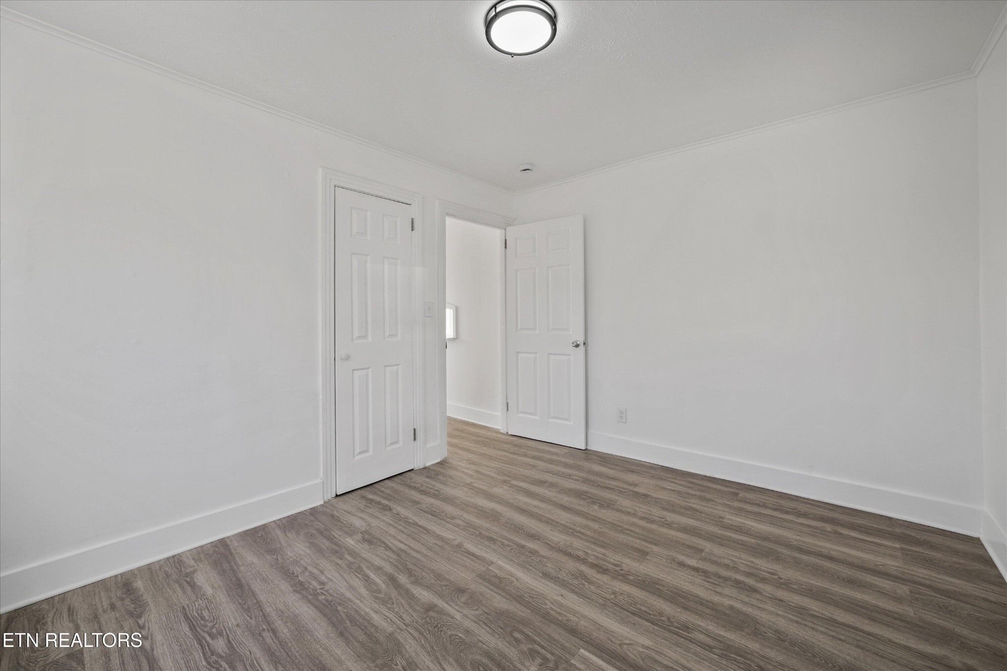 3001 Buffat Mill Road Knoxville, TN 37917 - Photo 13 of 28 a view of an empty room with wooden floor
