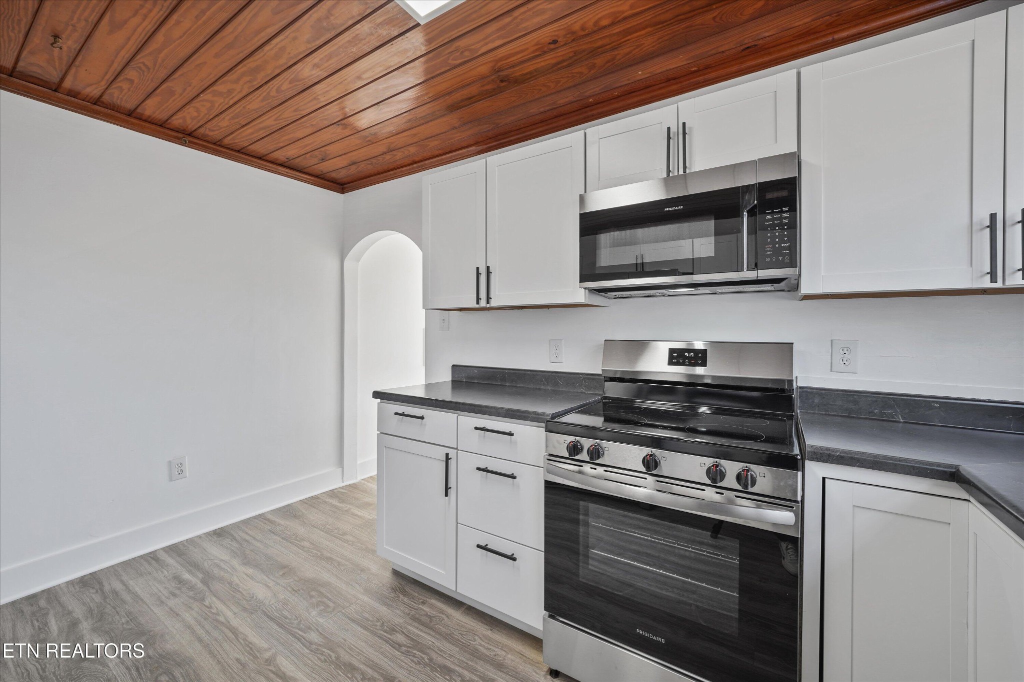 3001 Buffat Mill Road Knoxville, TN 37917 - Photo 17 of 28 a kitchen with stainless steel appliances granite countertop a stove microwave and sink