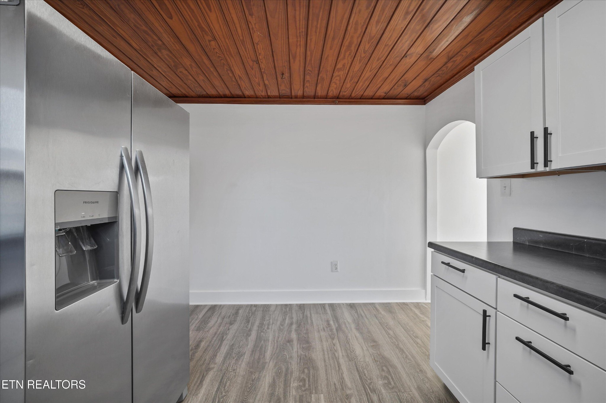3001 Buffat Mill Road Knoxville, TN 37917 - Photo 19 of 28 a kitchen with a refrigerator and cabinets