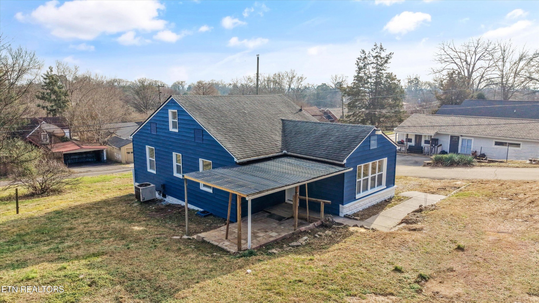 3001 Buffat Mill Road Knoxville, TN 37917 - Photo 28 of 28 a view of a house next to a big yard with an outdoor seating