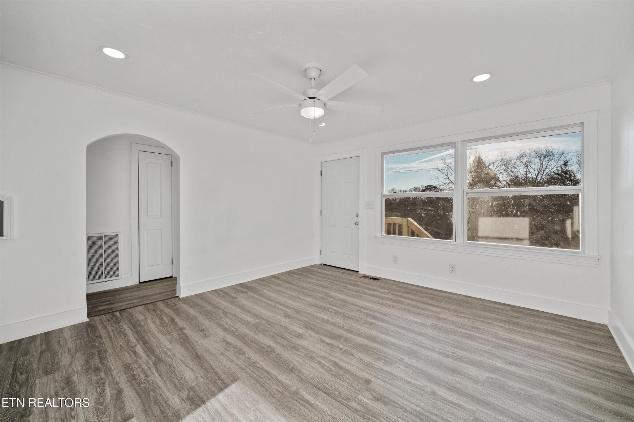 3001 Buffat Mill Road Knoxville, TN 37917 - Photo 6 of 28 wooden floor in an empty room with a window