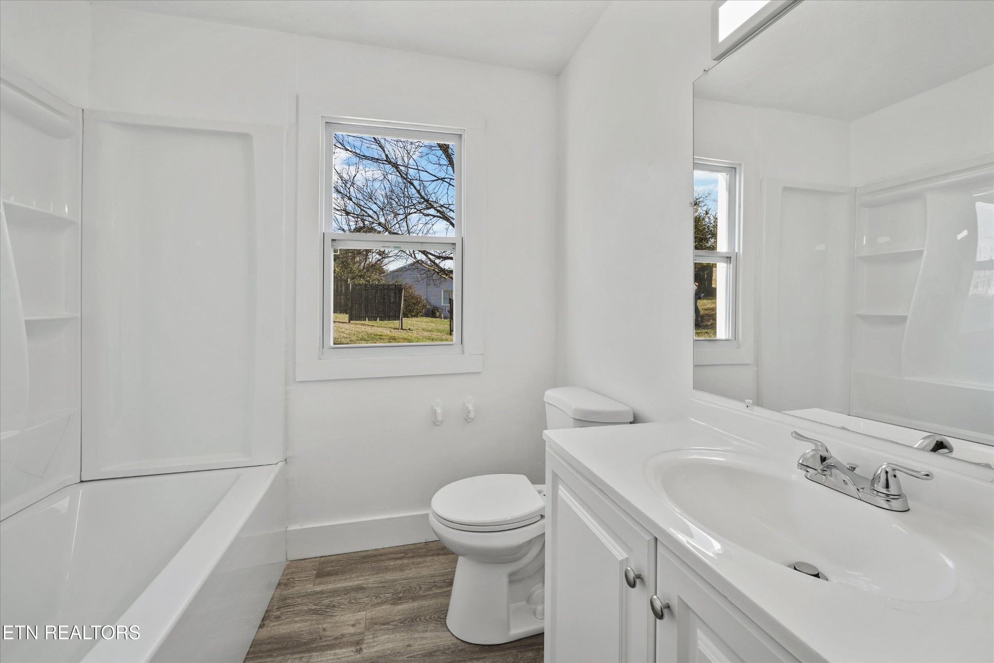 3001 Buffat Mill Road Knoxville, TN 37917 - Photo 10 of 28 a bathroom with a toilet sink and mirror