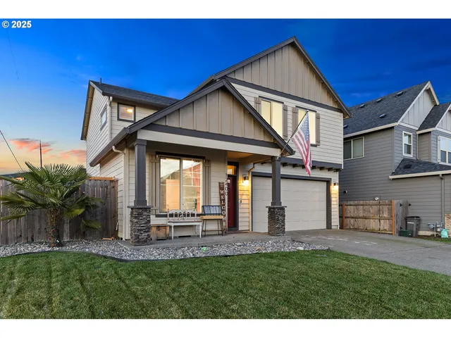 a backyard of a house with table and chairs