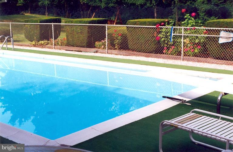 7932 Johnnycake Road Windsor Mill, MD 21244 - Photo 2 of 23 a view of a swimming pool with a patio