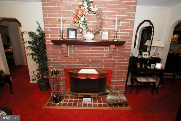 7932 Johnnycake Road Windsor Mill, MD 21244 - Photo 16 of 23 a dining room with furniture and wooden floor
