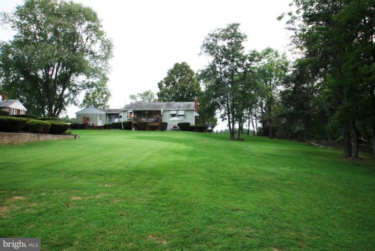 7932 Johnnycake Road Windsor Mill, MD 21244 - Photo 18 of 23 a view of field with trees in the background