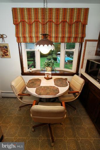 7932 Johnnycake Road Windsor Mill, MD 21244 - Photo 19 of 23 a balcony with table and chairs