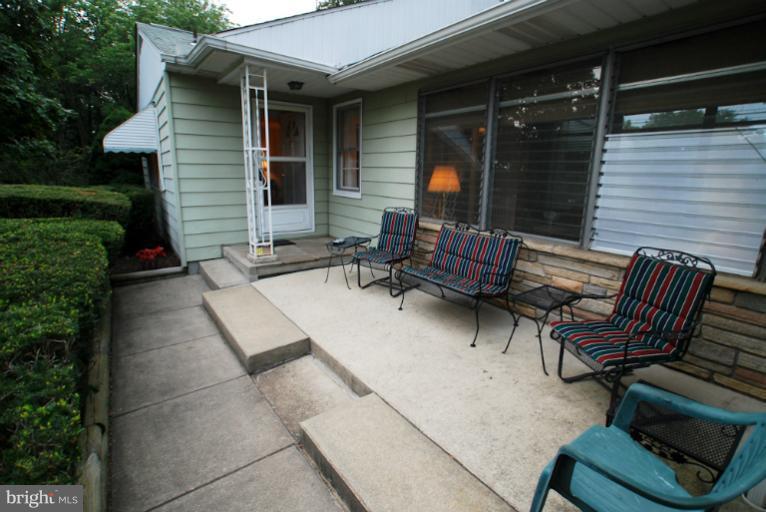7932 Johnnycake Road Windsor Mill, MD 21244 - Photo 10 of 23 a view of backyard with outdoor seating and green space