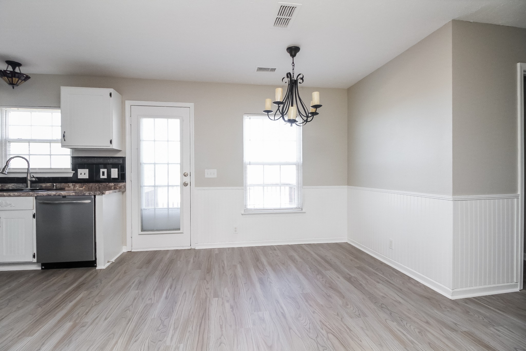 7015 Zither Lane La Vergne, TN 37086 - Photo 4 of 17 a view of a kitchen with a white cabinet and a stove top oven