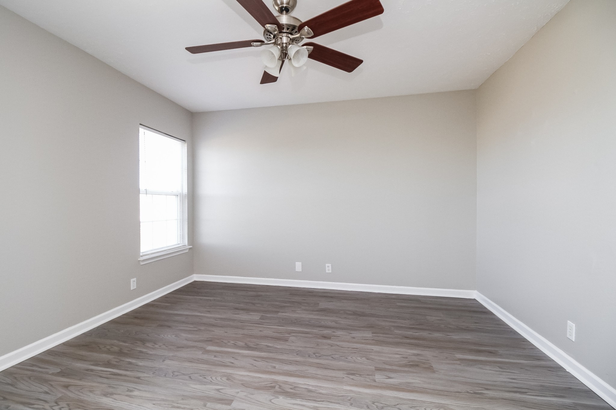 7015 Zither Lane La Vergne, TN 37086 - Photo 7 of 17 wooden floor in an empty room with a window
