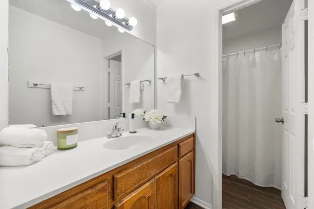 a bathroom with a sink double vanity and a mirror