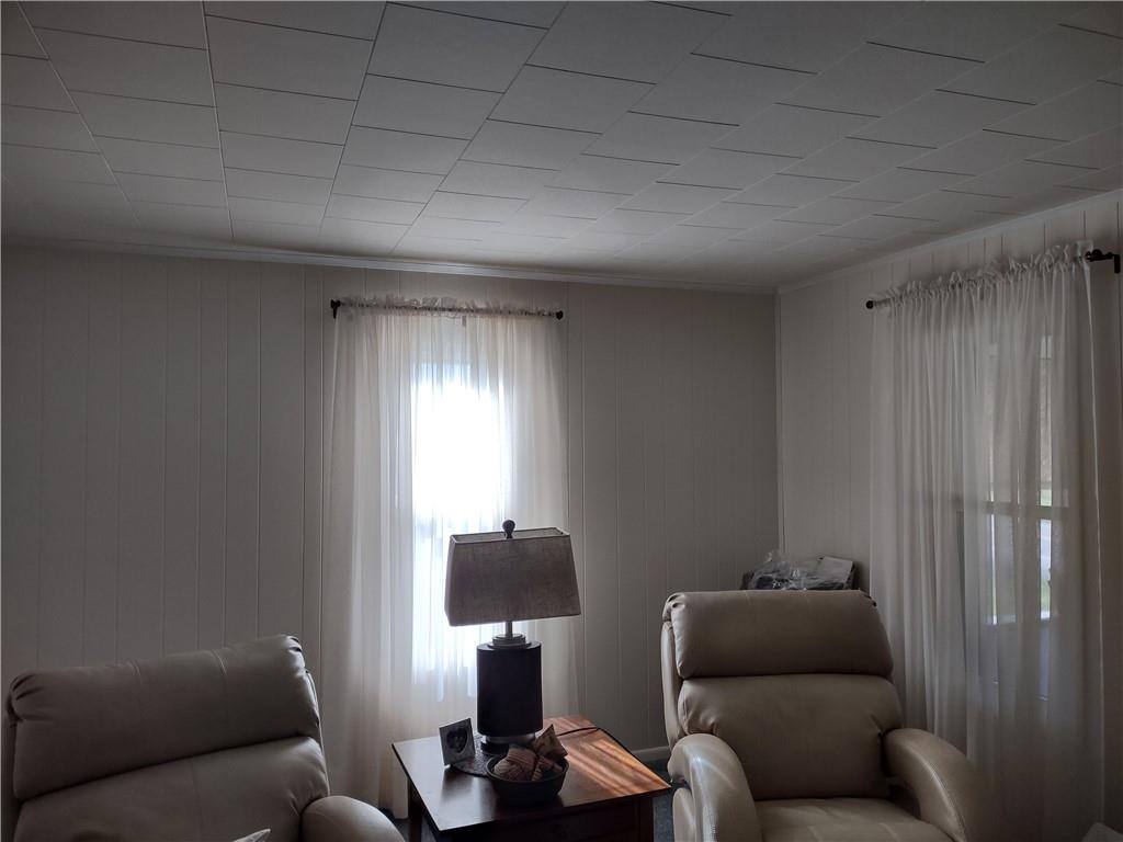 857 Mercer Grove City Road Mercer, PA 16137 - Photo 11 of 22 a living room with furniture a lamp and a window