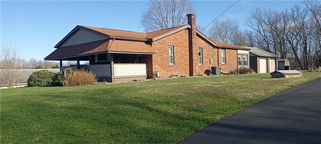 857 Mercer Grove City Road Mercer, PA 16137 - Photo 2 of 22 a front view of a house with a yard and garage