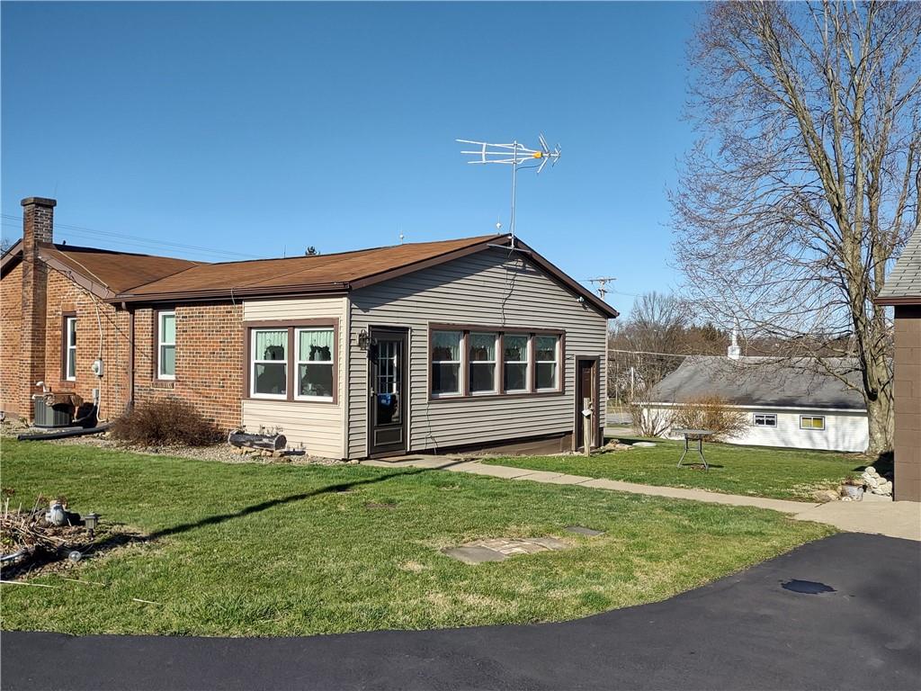 857 Mercer Grove City Road Mercer, PA 16137 - Photo 3 of 22 a front view of a house with a yard