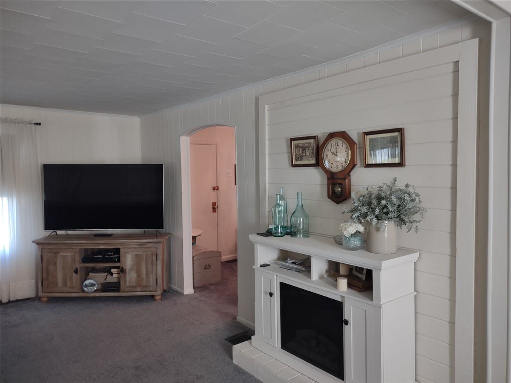 857 Mercer Grove City Road Mercer, PA 16137 - Photo 10 of 22 a living room with furniture and a flat screen tv