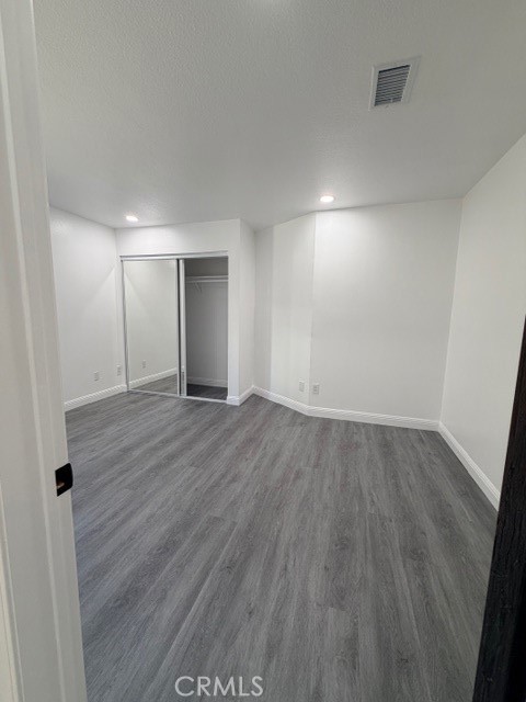 14744 Marymount Street Moorpark, CA 93021 - Photo 12 of 32 a view of an empty room with wooden floor
