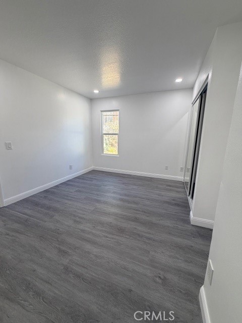 14744 Marymount Street Moorpark, CA 93021 - Photo 13 of 32 wooden floor in an empty room with a window