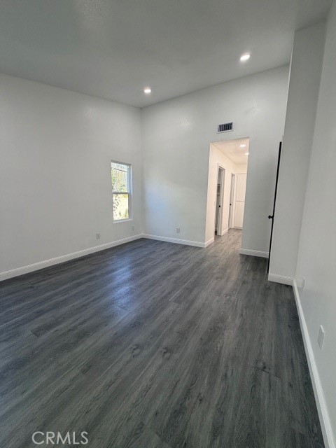 14744 Marymount Street Moorpark, CA 93021 - Photo 15 of 32 an empty room with wooden floor and windows