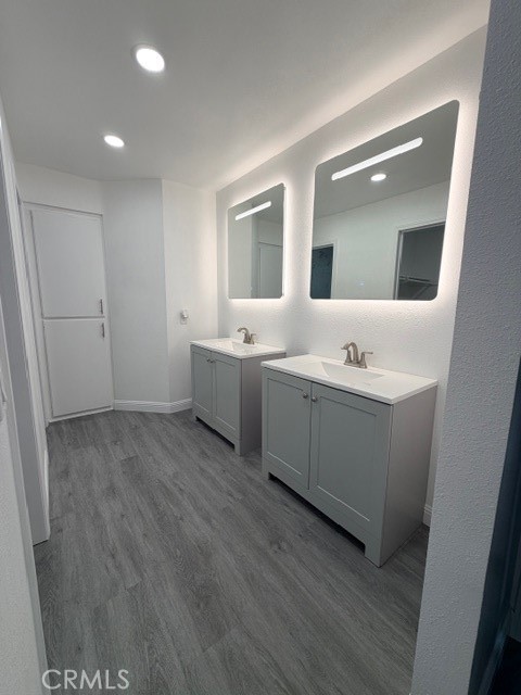 14744 Marymount Street Moorpark, CA 93021 - Photo 17 of 32 a view of bathroom with double vanity sink and mirror