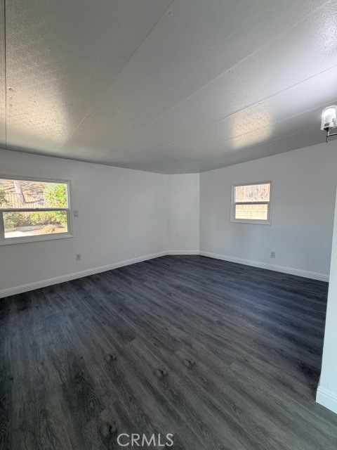 14744 Marymount Street Moorpark, CA 93021 - Photo 23 of 32 a view of an empty room with wooden floor and a window
