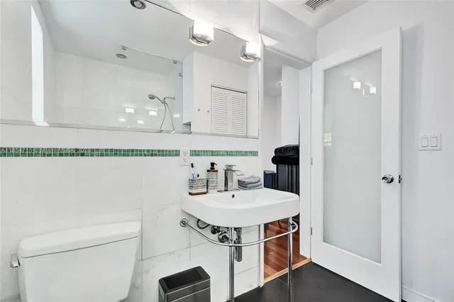a view of kitchen with a sink and wooden floor