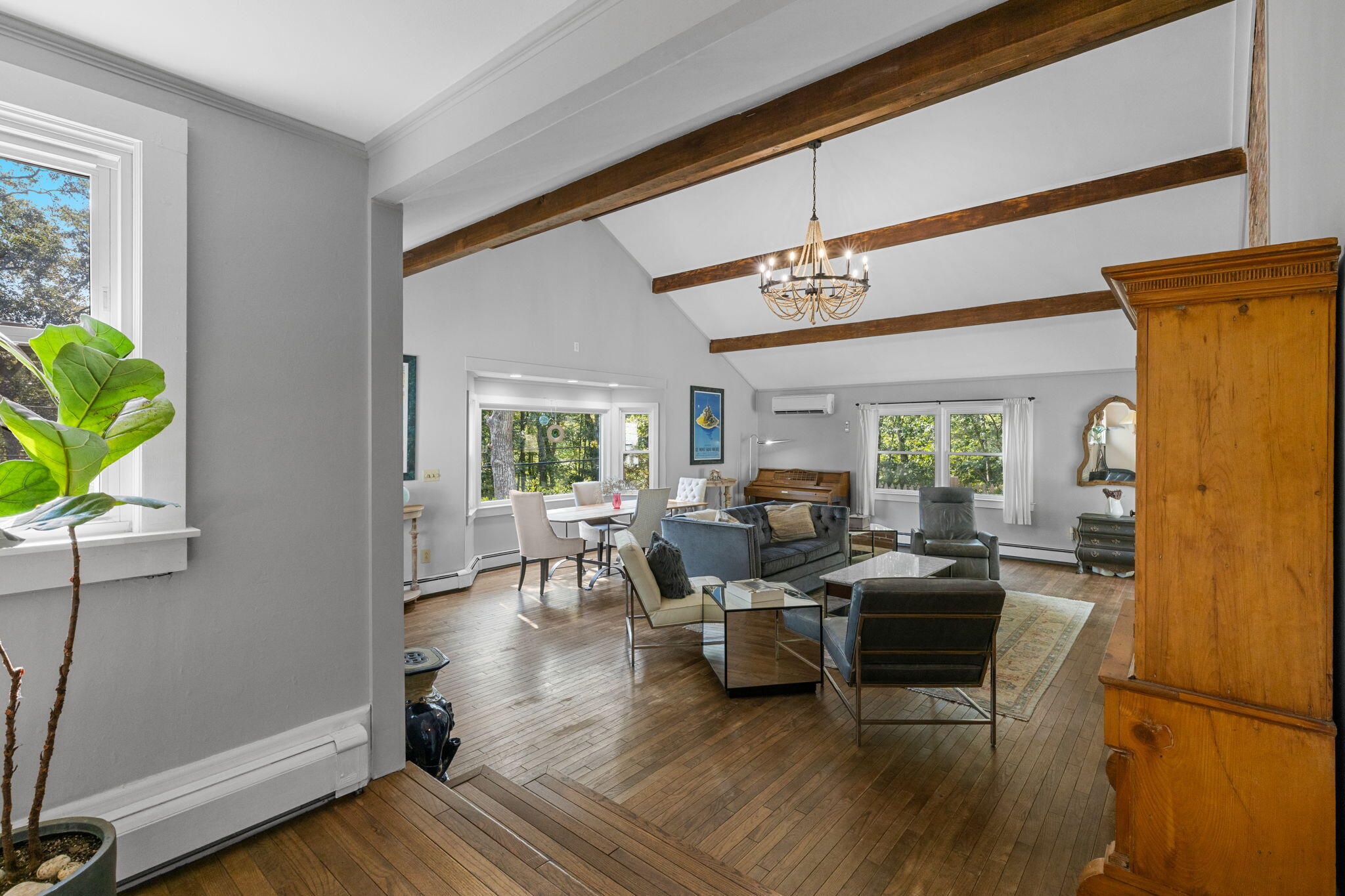 90 Paine Hollow Road Wellfleet, MA 02667 - Photo 11 of 30 a living room with patio furniture and a wooden floor