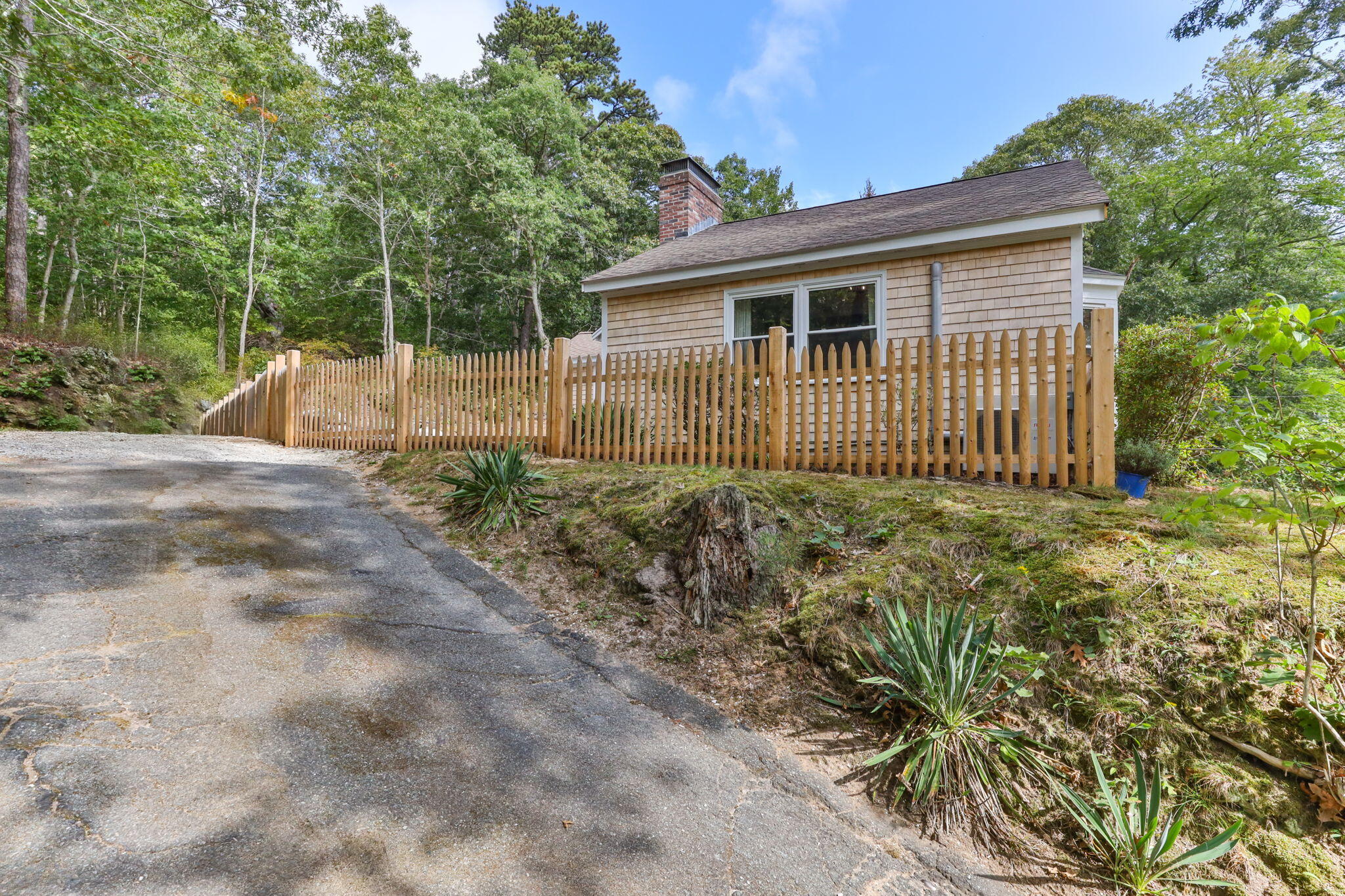 90 Paine Hollow Road Wellfleet, MA 02667 - Photo 28 of 30 a front view of a house with a garden