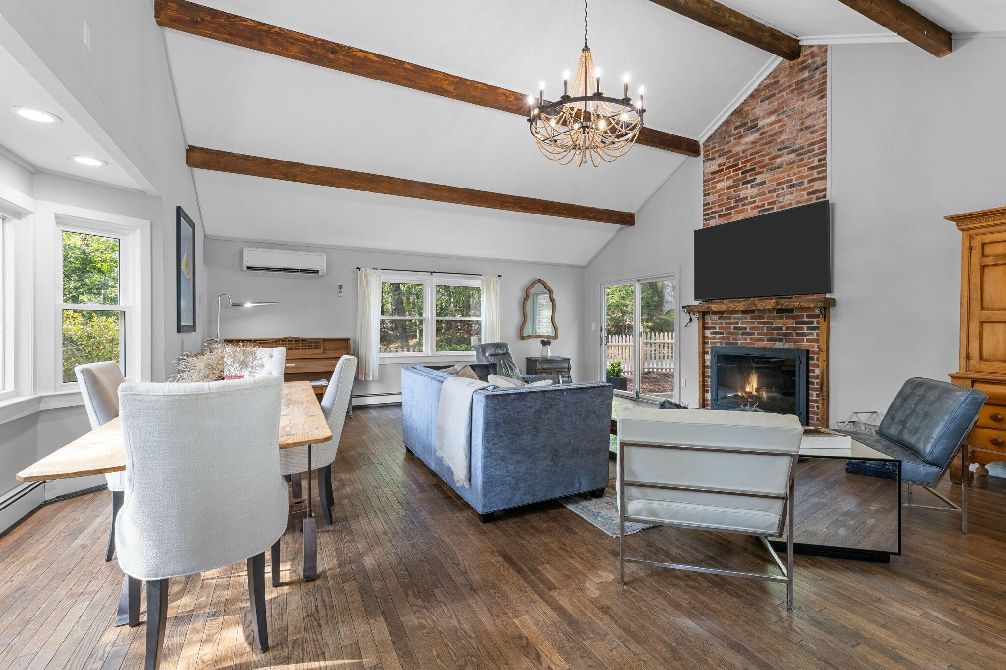 90 Paine Hollow Road Wellfleet, MA 02667 - Photo 7 of 30 a living room with furniture and a fireplace