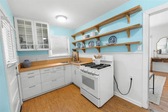 a kitchen with stainless steel appliances granite countertop a stove and a sink