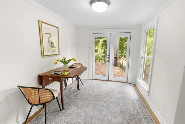 a view of a livingroom with furniture and a window