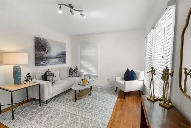 a living room with furniture and a table