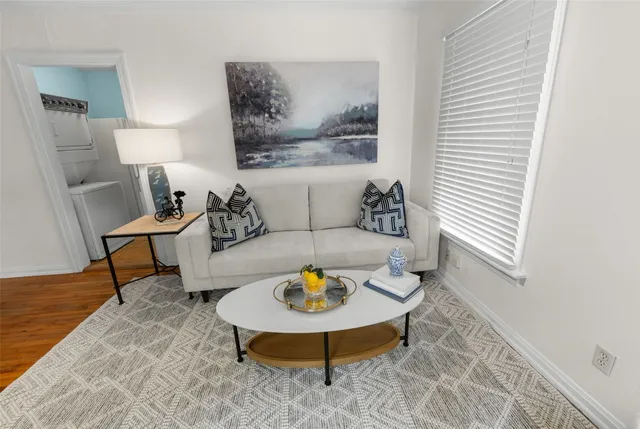 a living room with furniture and a table