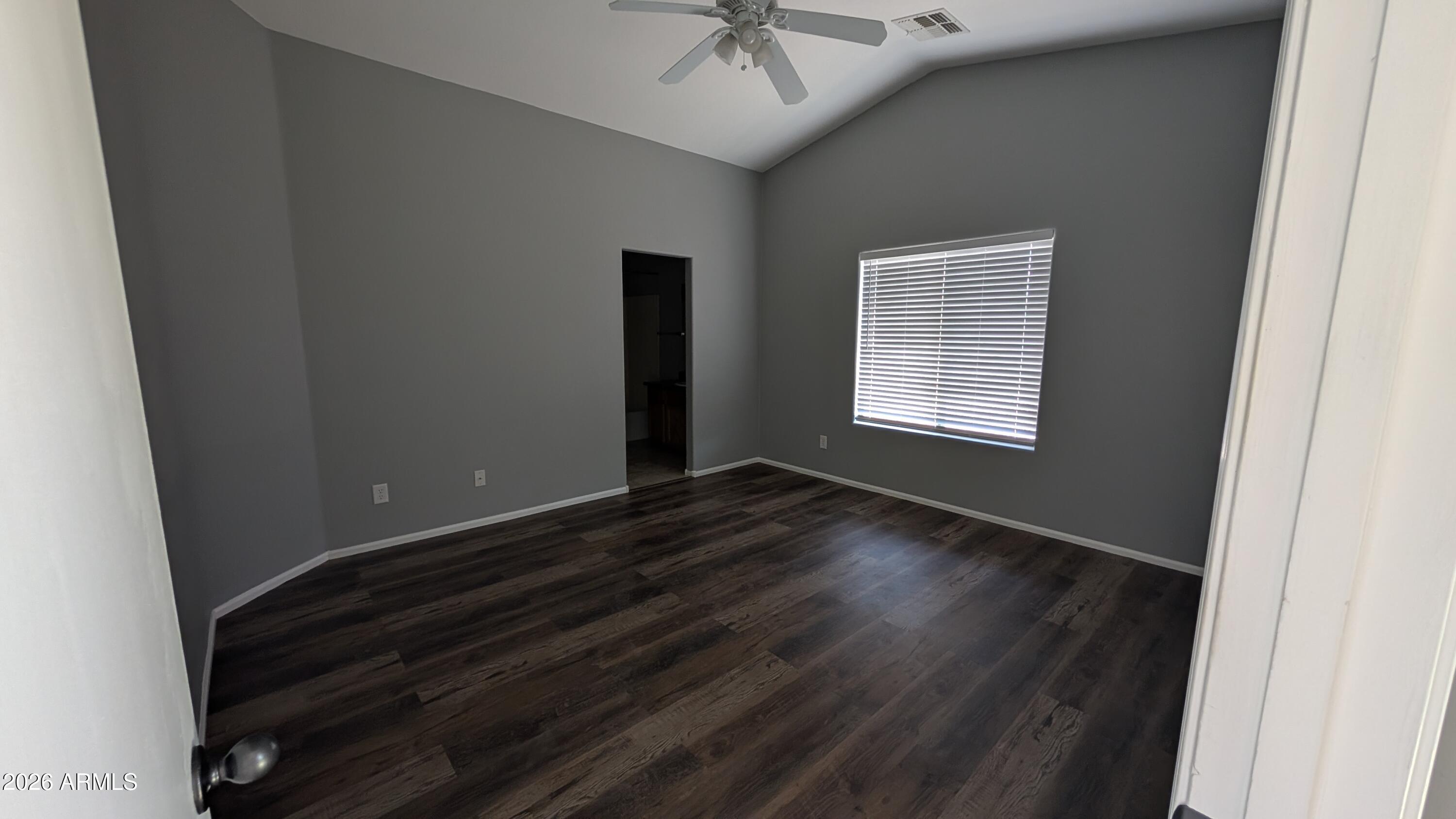 1377 East Pryor Road San Tan Valley, AZ 85140 - Photo 11 of 31 an empty room with wooden floor and windows