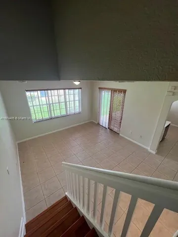 a view of empty room with windows