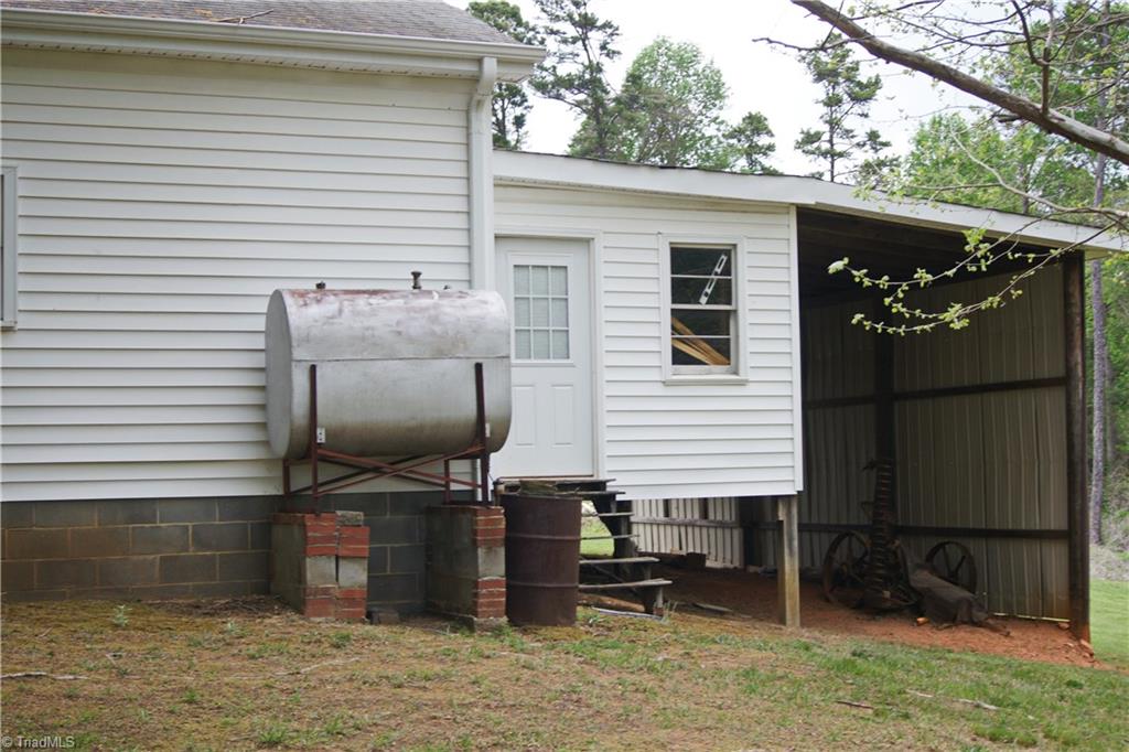 4350 McIntyre Road Gibsonville, NC 27249 - Photo 14 of 14 Rear garage with tractor shed.