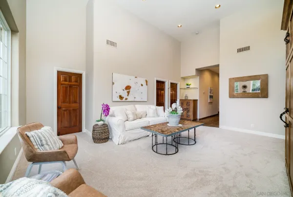 a view of a bedroom with a bed and furniture
