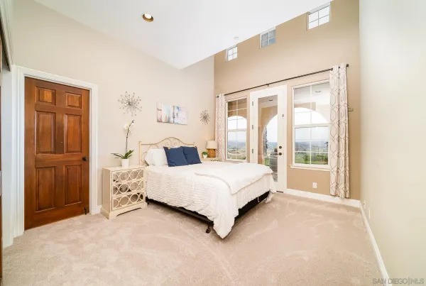 a spacious bathroom with a double vanity sink double vanity and a large mirror