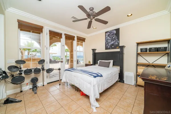 a bedroom with a bed a table and chair