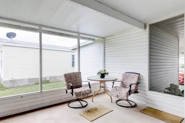 a work room with furniture and white walls