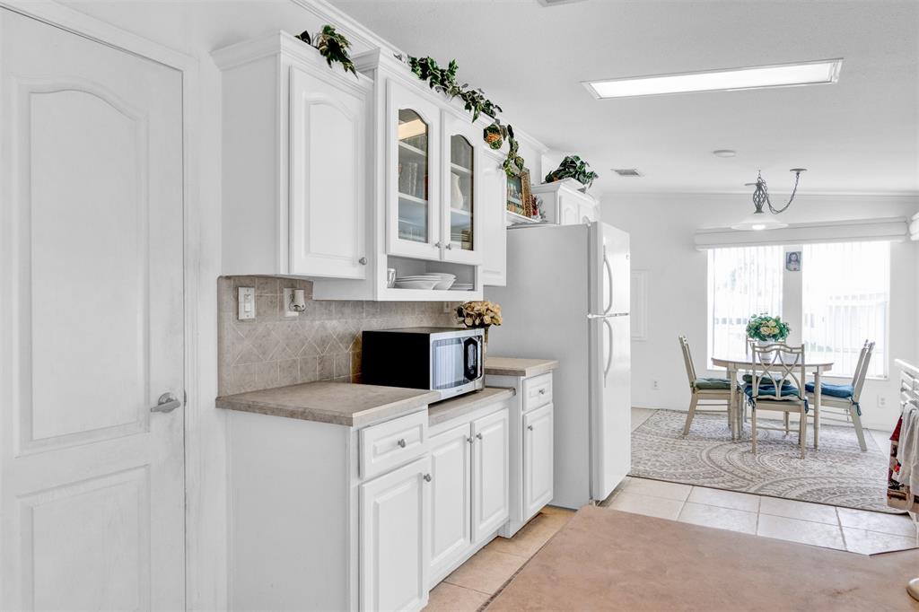 2405 Kelly Sebastian, FL 32958 - Photo 4 of 17 a kitchen with stainless steel appliances a stove a refrigerator and a refrigerator