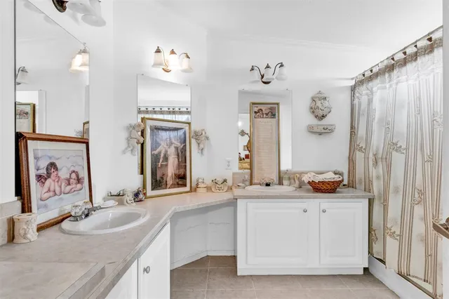 a bathroom with a double vanity sink mirror and double