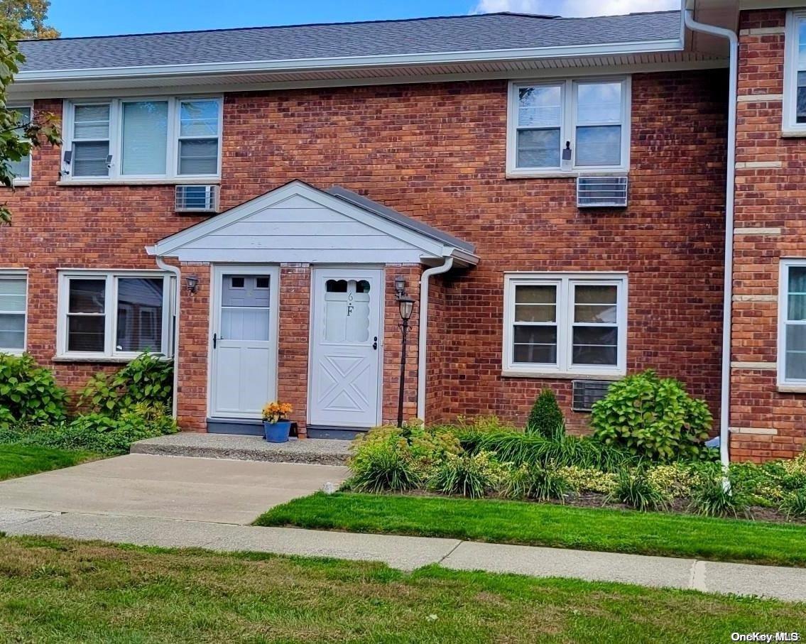 2710 South Road, Unit F6 Poughkeepsie, NY 12601 - Photo 1 of 1 a front view of a house with a yard and garage