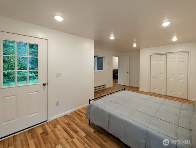 a bedroom with a bed and a window