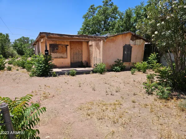 a pathway of a house with a yard