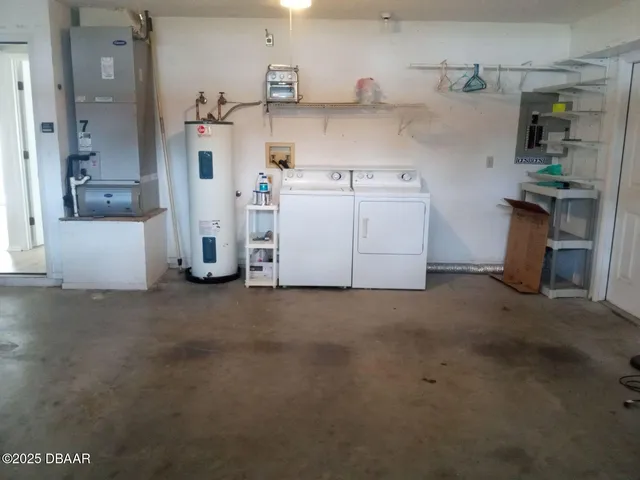 a view of a storage & utility room with a sink