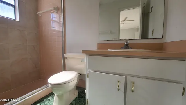 a view of house with backyard and porch