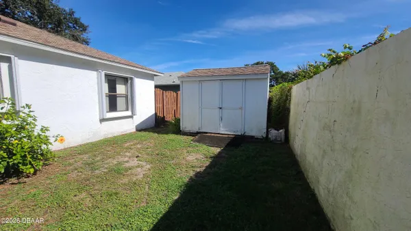 a view of a backyard of the house