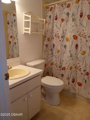 a bathroom with a sink and toilet