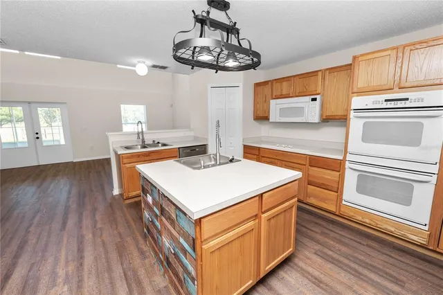 a kitchen that has a lot of cabinets in it
